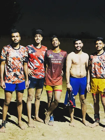 A small group of players after a night practice session under the lights.