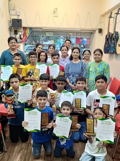 A proud group of chess tournament winners and participants with their families and instructors. What a great day for our chess community!