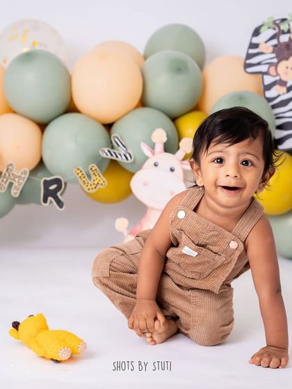 A happy crawl towards the camera after the cake is gone. The energy and joy of a one year old are contagious, and I aim to capture that in every shot.