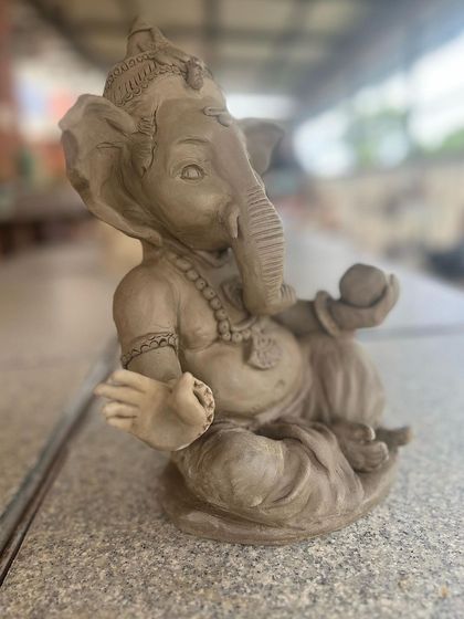 One of my own Ganesha idols, captured in a moment of peace. The process of sculpting him is a form of meditation for me, a truly happy moment.