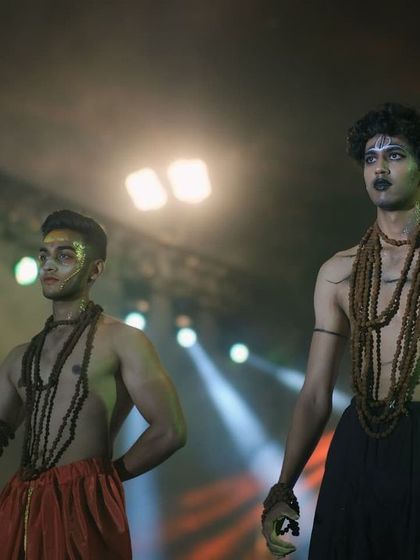 Two students in character as Aghori sadhus for a theme-based fashion show. I focus on capturing the detail in their makeup and their intense expressions.