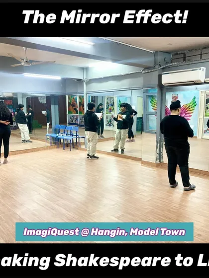 A wide shot of our studio during a "Shaking Shakespeare to Life" rehearsal. Multiple students are using the large mirrors to practice their monologues simultaneously, a core part of our drama training.
