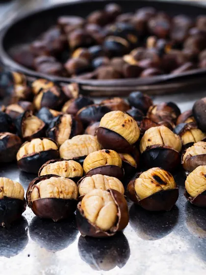 Roasted chestnuts on a street vendor's cart in Istanbul. The image captures a simple, seasonal, and nostalgic food moment.