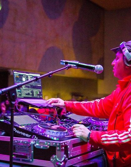 A snapshot of me DJing at a gala. I'm comfortable playing in a variety of settings, from gritty clubs to formal museum events.