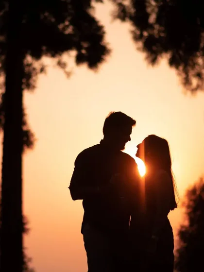 There is a classic beauty in a silhouette against a setting sun. This shot of Ishu and Arihant is all about their connection, framed by the trees and the warm glow of sunset. It’s a simple, powerful, and timeless portrait.