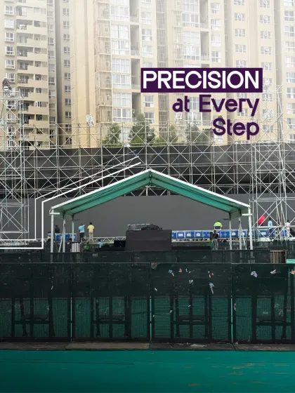 Precision at every step. This image highlights our commitment to flawless execution, showing a stage build in progress against an urban backdrop.