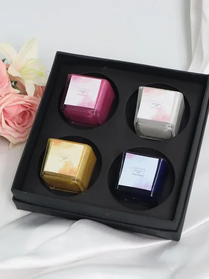 This gift set of four colorful square glass candles is a perfect present for Mother's Day or any special occasion. The elegant black box highlights the vibrant candle colors.