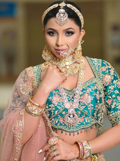A full-look portrait that shows how the makeup, jewelry, and outfit come together. The result is a cohesive and stunning bridal ensemble.