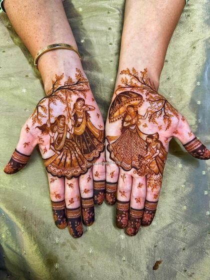 Another view of the Teej festival mehandi, highlighting the intricate details of the figures and surrounding floral patterns.