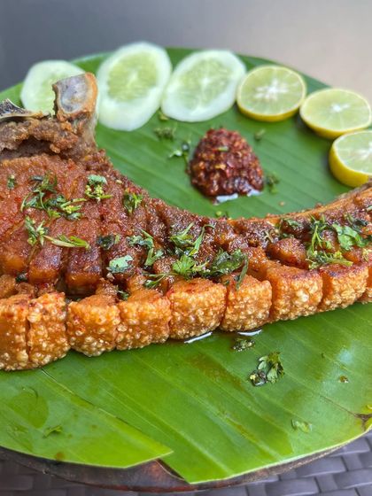A close-up of the incredible texture on our crispy pork ribs. Each bite delivers a satisfying crunch followed by tender, flavorful meat.