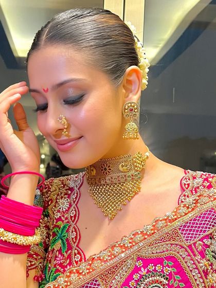 A close-up on the details of Isha Malviya's traditional look. The smokey eye, bindi, and nose ring come together for a perfect festive style.