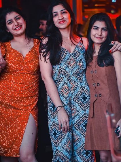 A stylish trio enjoying the Bollywood magic at The Fixx.