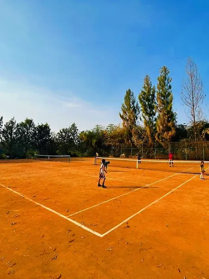 Welcome to our home. Our serene, green campus in Yelahanka, Bangalore, features professional-grade clay courts built for serious, focused training away from the city's distractions.