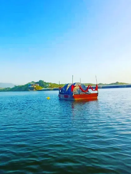A daytime view of our unique floating platform, equipped with a tent for a one of a kind camping experience. This setup allows you to be right on the water, surrounded by nature.
