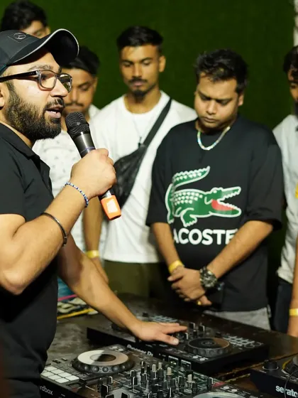 Learning is interactive here. An instructor demonstrates mixing techniques on a Pioneer controller to an attentive group of aspiring DJs during our FLYP 2.0 workshop.
