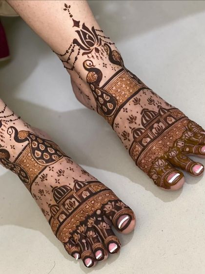 A clear shot of the modern foot mehendi, highlighting the clean lines and unique composition.