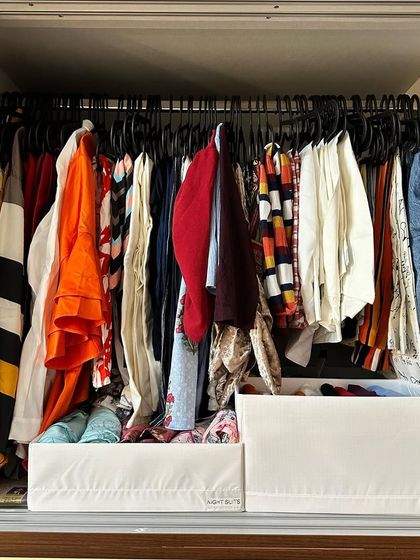 Another example of utilizing the shelf below a hanging rod. These open-front bins make it easy to see and grab what you need without disturbing the rest of the items.