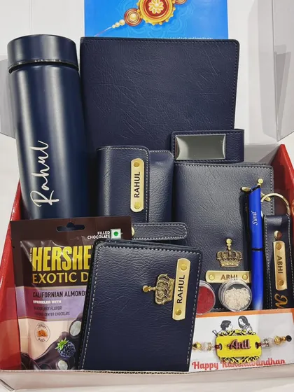 This Rakhi hamper is a perfect example of a complete gift solution. It includes a personalized flask, wallet, keychain, and other accessories, all coordinated in a stylish navy blue theme for a thoughtful and impressive present.