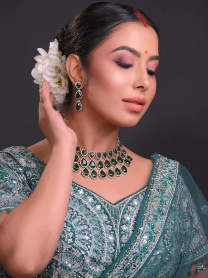 A close-up on the eye makeup, showing a soft blend of pinks and browns for a romantic feel.