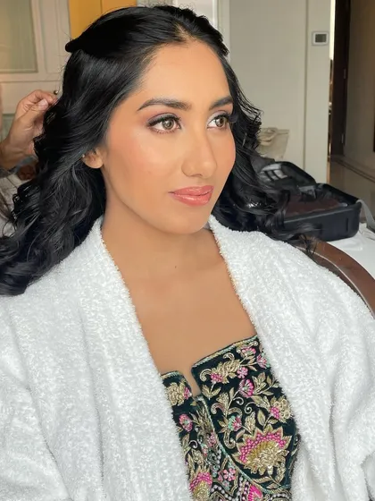 Another angle from the getting-ready process. The focus is on creating a flawless, long-lasting base that will look perfect all day.