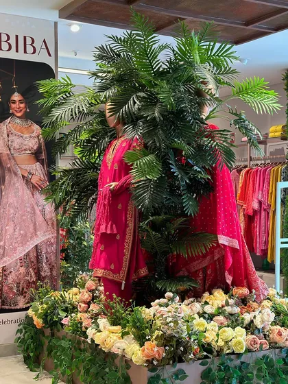 Fashion meets nature in this creative display at the BIBA store. We designed a floral and foliage base for the mannequin, seamlessly blending the clothing collection with a botanical theme.