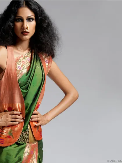 Vibrant poise meets contemporary chic. A studio shot of supermodel Nethra Raghuraman, blending a traditional Paithani saree with a modern jacket.