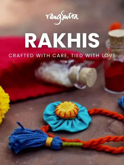 Crafted with care, tied with love. This handmade Rakhi, featuring a vibrant blue fabric flower and tassels, comes in a small pouch, making it a perfect token of affection.