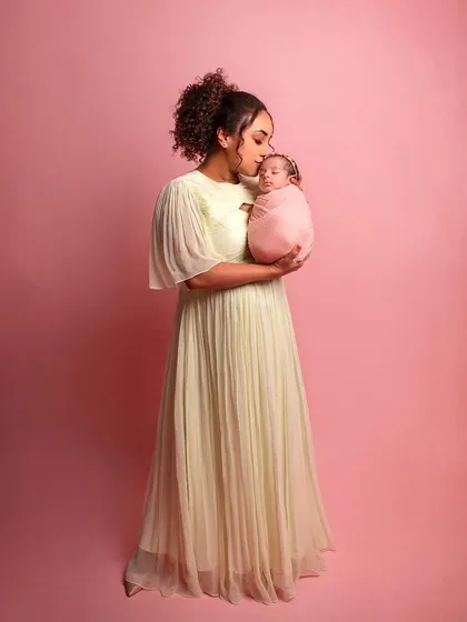 A tender moment between mother and daughter. These are the quiet, loving portraits that families will cherish forever.