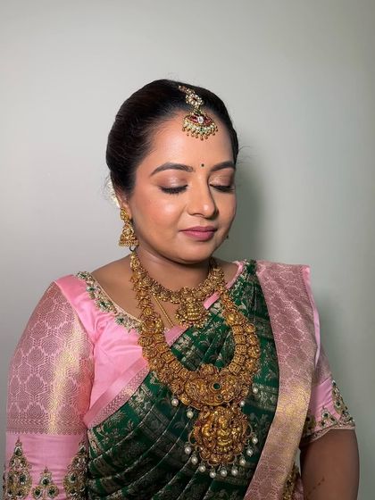 A detailed view of the eye makeup for this traditional look. The soft brown and gold tones on the eyelid create a sophisticated effect that enhances the eyes without being overpowering.