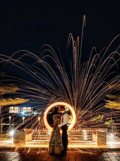 We live for creating moments of pure magic. This stunning light-painting portrait of Prerna and Viraj at Amita Rasa captures the spark of their new beginning, a testament to how we frame love stories against spectacular backdrops.