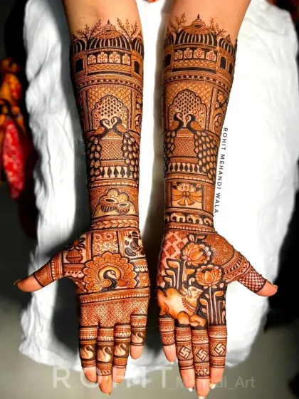 This full-arm design showcases my skill with symmetrical patterns. I have used peacock and lotus motifs, which are classic symbols in bridal henna, along with architectural dome patterns for a royal look.