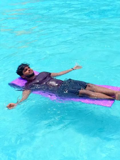 Relaxing and floating in the pool, a perfect way to unwind after a long week.