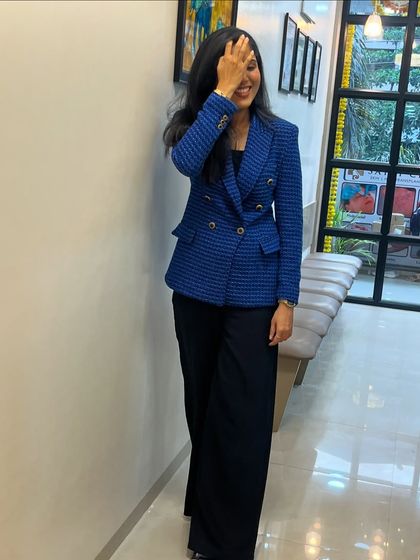 A candid moment at my clinic. While I take my work very seriously, I strive to create a warm and approachable atmosphere for all my patients.