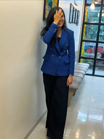 A candid moment at my clinic. While I take my work very seriously, I strive to create a warm and approachable atmosphere for all my patients.