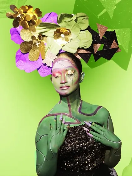 A full view of a fantasy makeup creation. This look combines intricate body painting, a custom headpiece, and dramatic nail art to create a complete character, showcasing the diverse skills taught in our creative makeup courses.