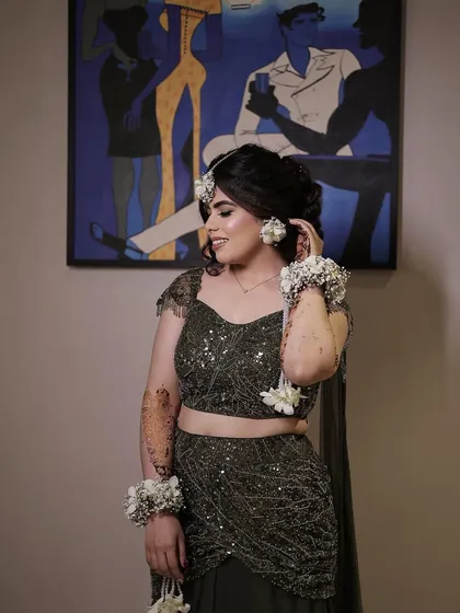 Green and gorgeous! My beautiful bride Simi chose a dreamy Mehendi look with an olive green lehenga and floral jewelry. The makeup was kept soft and glowing to complete the magical vibe.