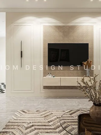 A floating media unit is set against a wall with classic panel molding. This blend of modern furniture and traditional architectural details is key to our contemporary neoclassical style.