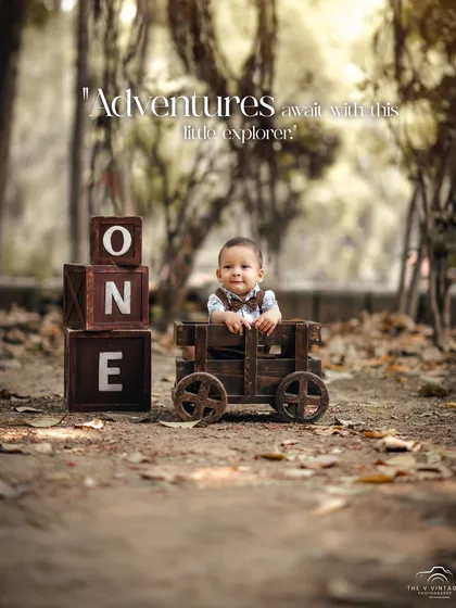 This little explorer is ready for adventure in his wooden wagon. Our outdoor first birthday sessions in the park are perfect for capturing a rustic, natural feel.