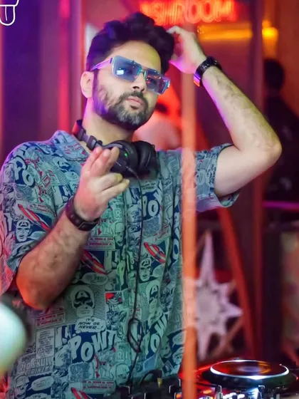Aye Gun-Pat chal. A fun pose from behind the decks, ready for a Saturday night rager at ToyBoy.
