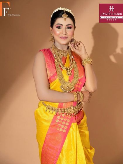 A closer view of the South Indian bridal makeup, highlighting the traditional gold jewelry and radiant makeup.