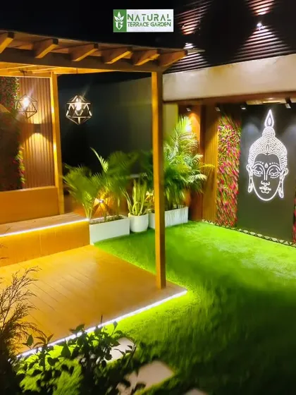 A completed project in Gurgaon's Gwal Pahari, featuring a wooden pergola with decorative panels showing Radha and Krishna.