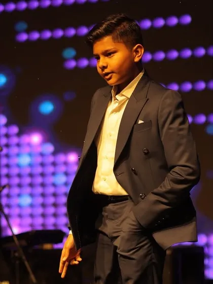 The youngest performer of the night, looking sharp and confident. We love teaching kids and making them feel like stars.
