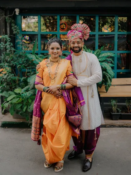 A classic wedding portrait of Rahul and Jagruti. Their coordinated outfits and happy smiles make for a perfect memory of their special day.
