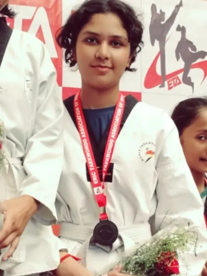 A close-up of one of our dedicated medal winners. The focus and determination learned in training shine through on competition day.