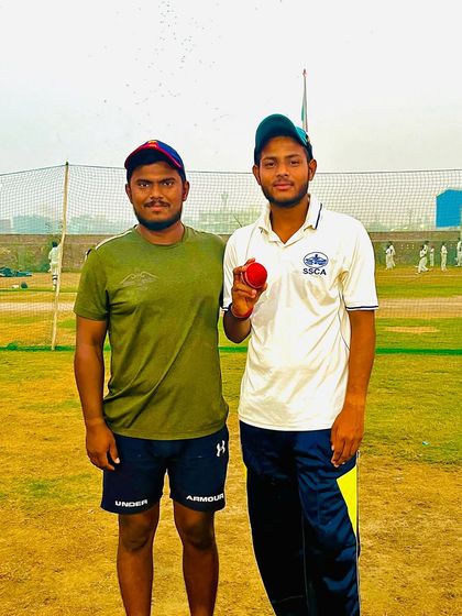 Abhishek Jha with the match ball after a great spell, taking 6 wickets.