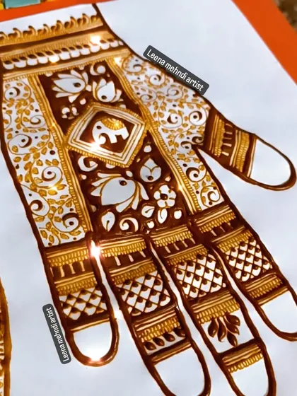 A practice design for a full-hand pattern, featuring elephants and birds.