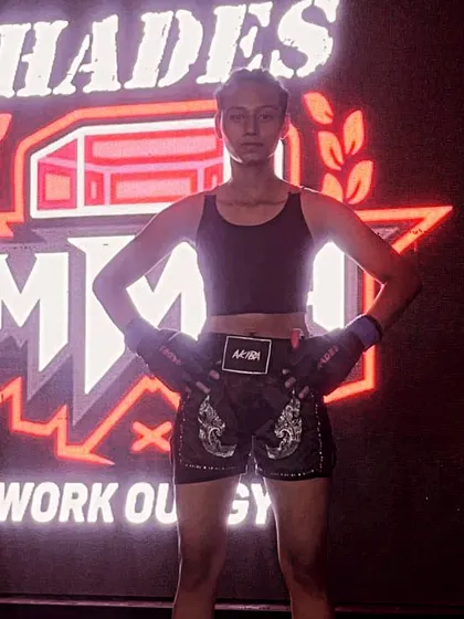 A female fighter from my team, confident and ready before her match at the Hades MMA workout gym.