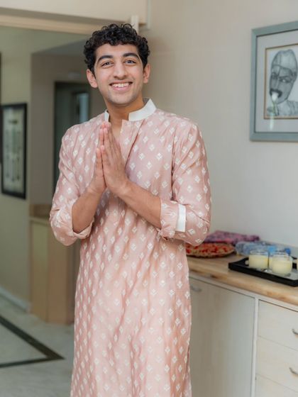 A soft and elegant look for one of the pre-wedding functions. This custom-made blush pink patterned kurta is perfect for a daytime event like the Bane Bithai ceremony, offering a fresh and modern take on traditional wear.