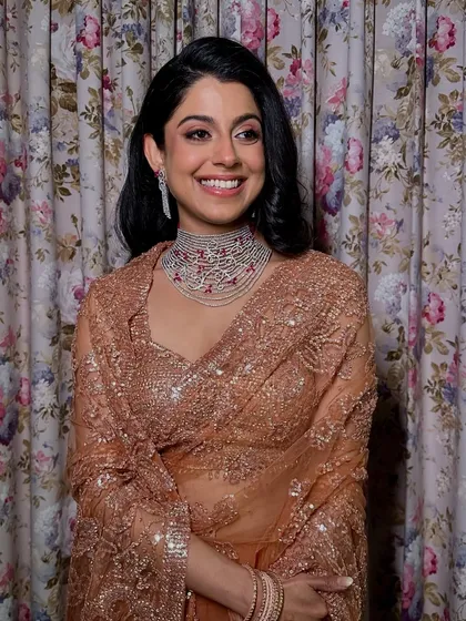A beautiful portrait of this bride's cocktail night elegance. The makeup is polished and refined, letting her natural beauty and joyful expression take center stage.