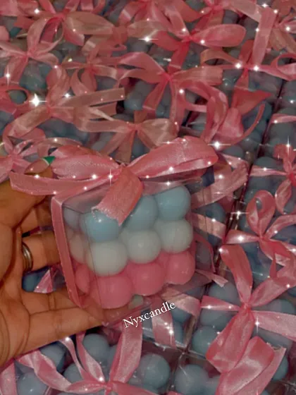 Another look at the pink and blue bubble candles, all packaged and ready to go for a baby shower. The clear box and pink ribbon make for a sweet presentation.